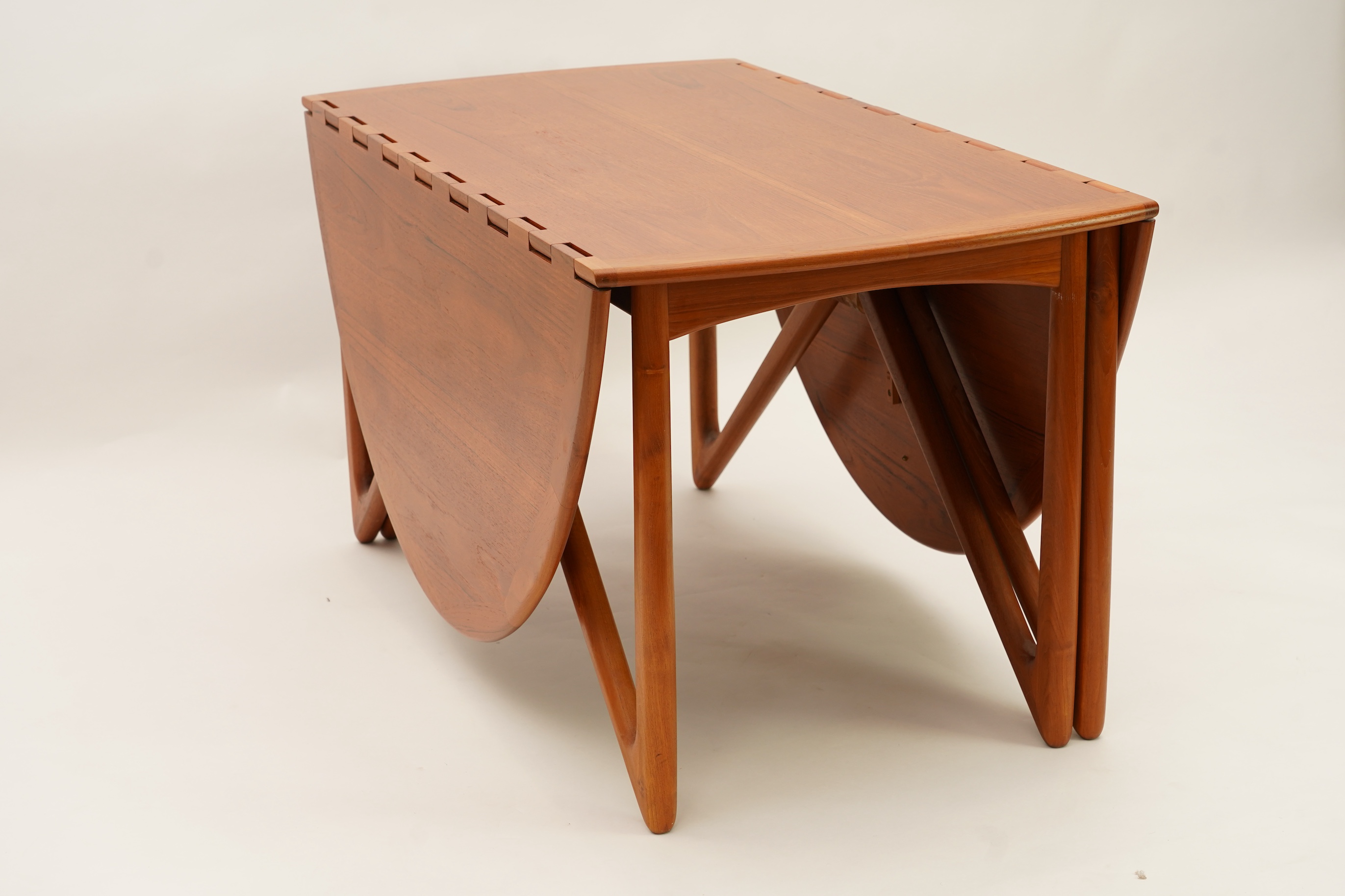 Niels Koefoed (Danish, b. 1929) for Koefoeds Møbelfabrik: A teak 'Oval Klap' dining table